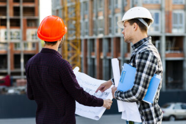 medium-shot-back-view-engineer-architect-supervising-construction